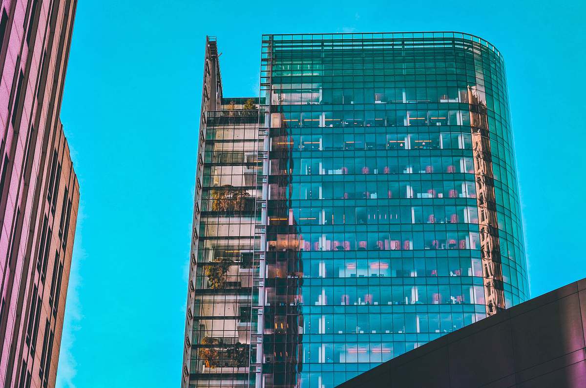office building red and blue high rise building city